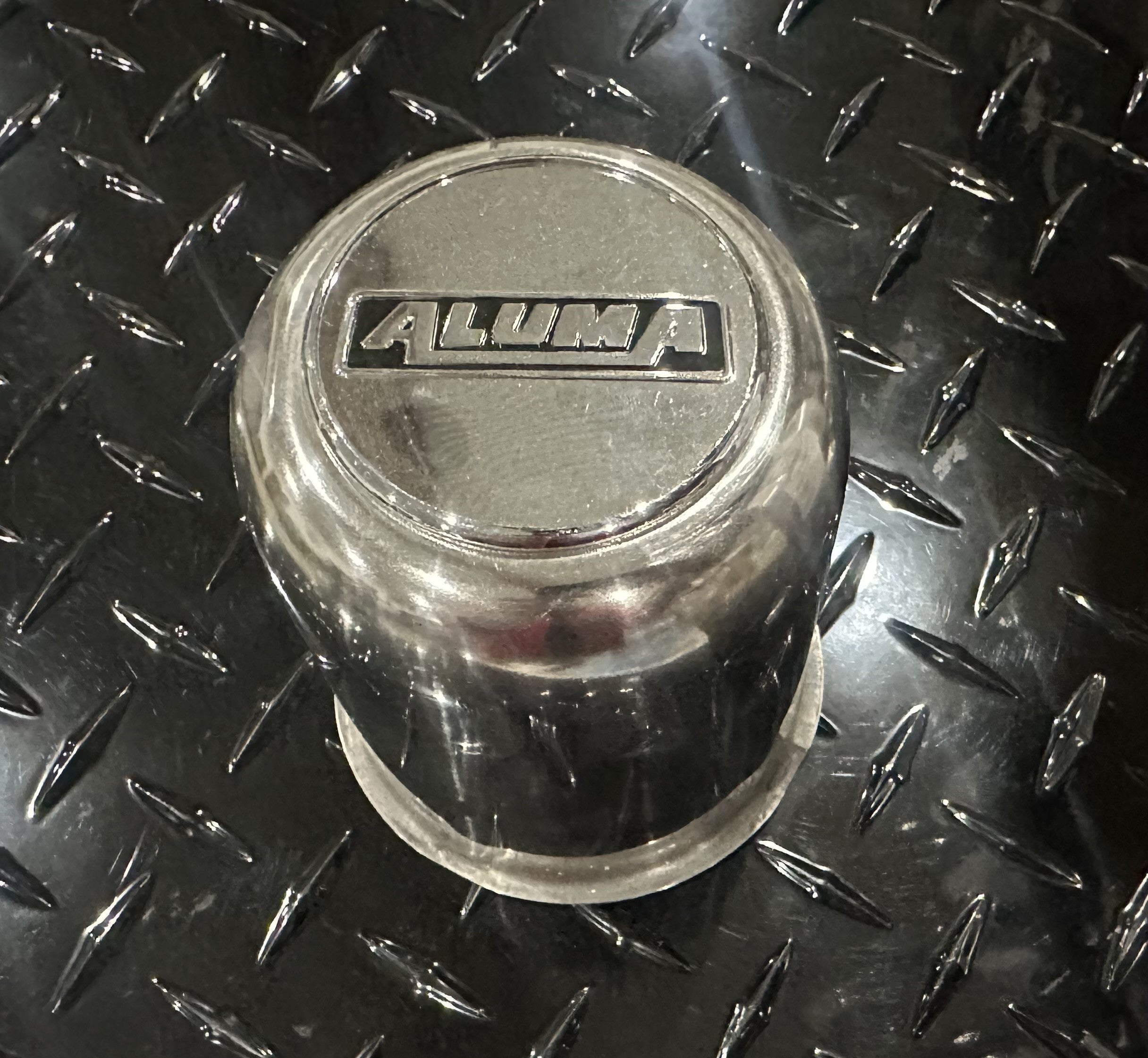 Aluma 4.28-inch axle center cap for trailer axle components, metallic finish, designed for Indiana Trailer Sales.