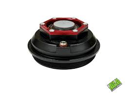 Aluminum Valcrum oil cap with 4-inch OD screw-in design for 10-15K Dexter trailer axles, shown on axle component.