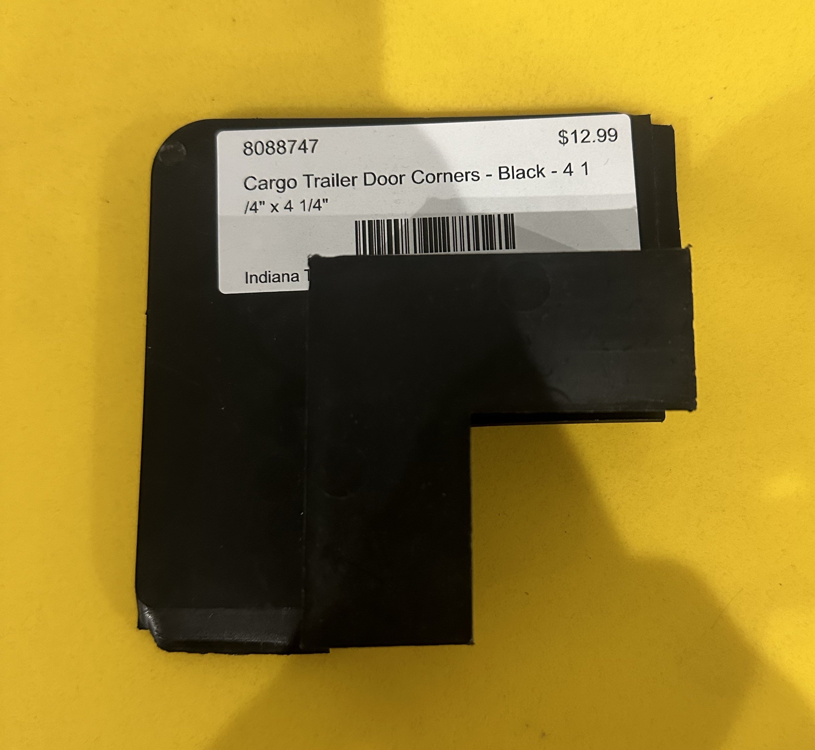 Black cargo trailer door corners, 4 1/4" x 4 1/4", body and frame components for trailer door repair or replacement.