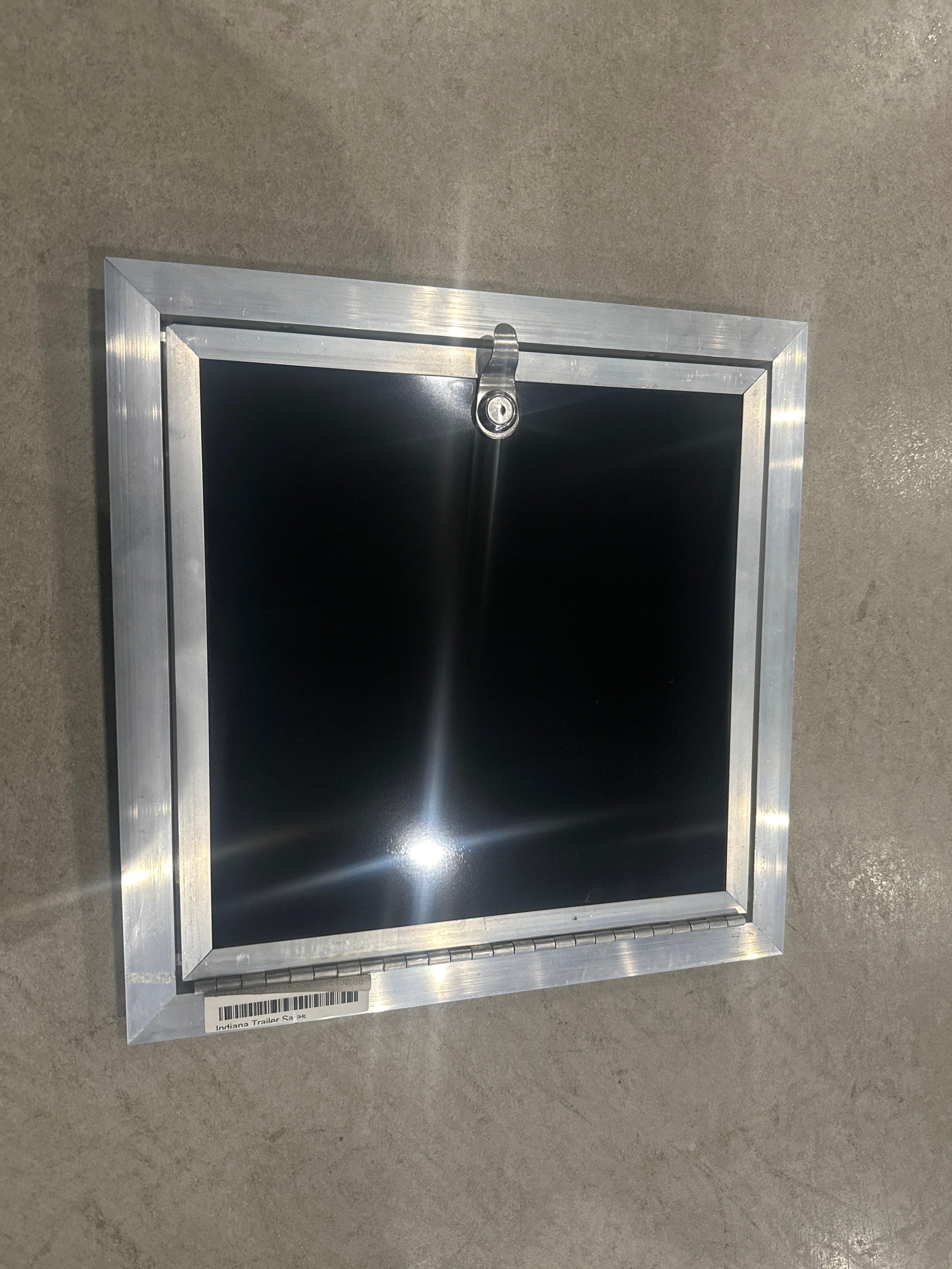Black Discovery Fuel Door 14x14 for trailer body and frame components, with sturdy construction from Indiana Trailer Sales.