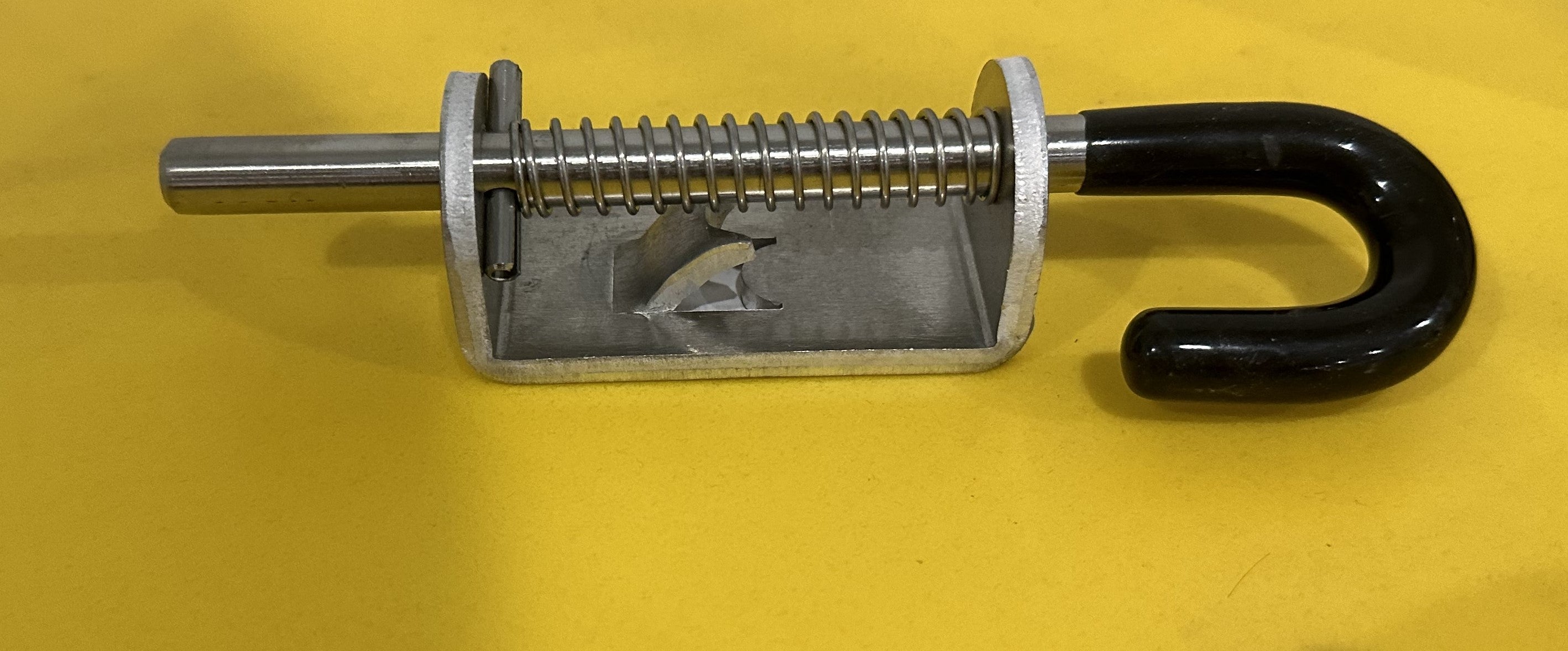 Spring gate latch for trailer body and frame, designed for secure closure and easy operation by Indiana Trailer Sales.