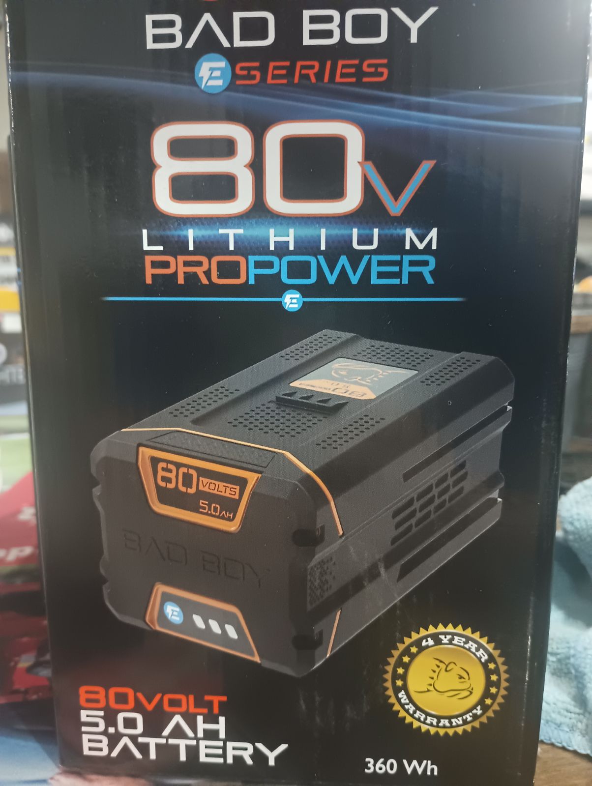 80V 5.0 Ah battery for power tools, displayed with Indiana Trailer Sales branding, showing the battery's compact design and labels.