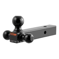Triple ball mount for trailers by Curt, featuring three hitch balls on a sturdy metal frame for towing multiple trailers.