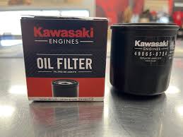 Kawasaki oil filter for motorcycles, shown in a close-up image with packaging and branding from Indiana Trailer Sales.