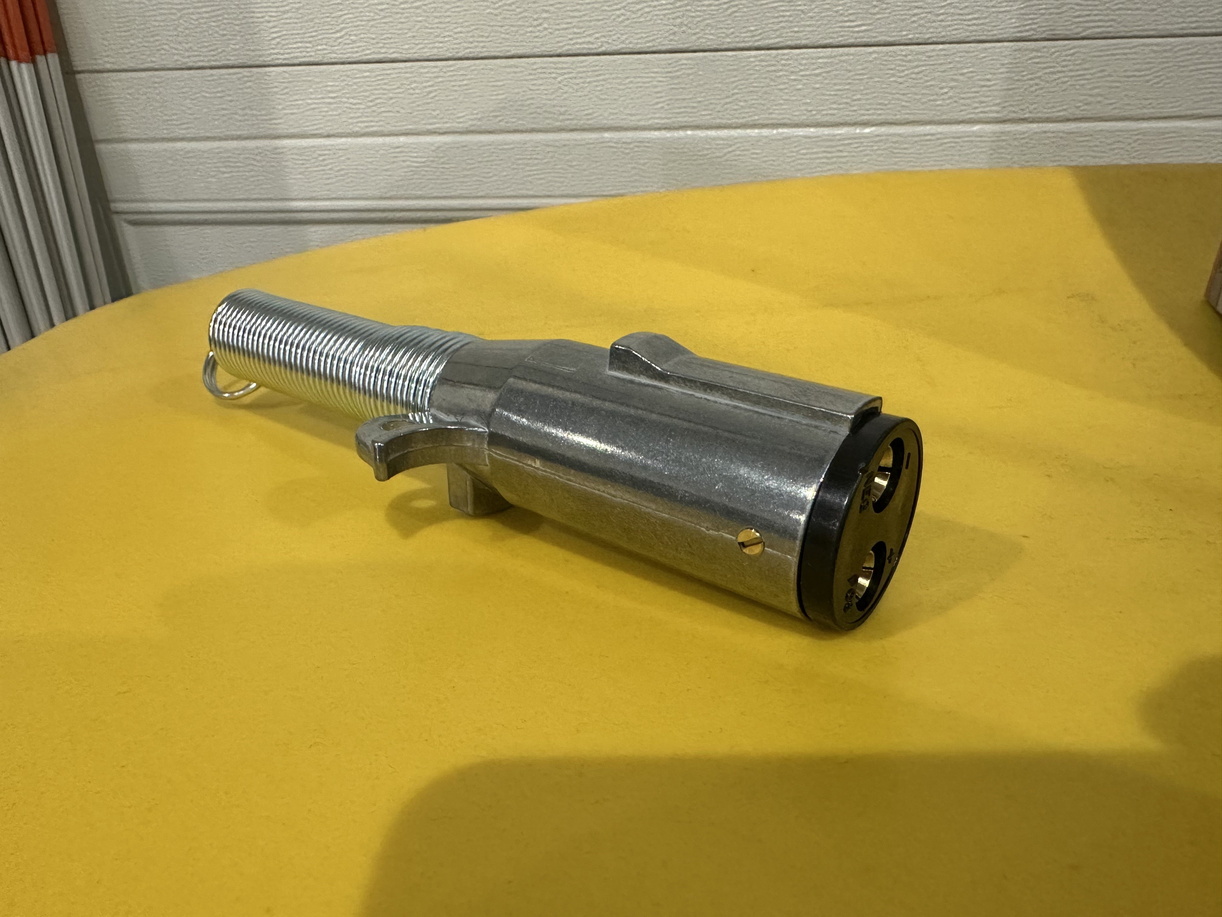 Buyer Products 2-Way Die-Cast Zinc Trailer Connector with vertical pins and spring for trailer side electrical connection.