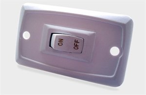 Enclosed trailer wall switch for electrical and lighting control, shown mounted inside a trailer, by Indiana Trailer Sales.