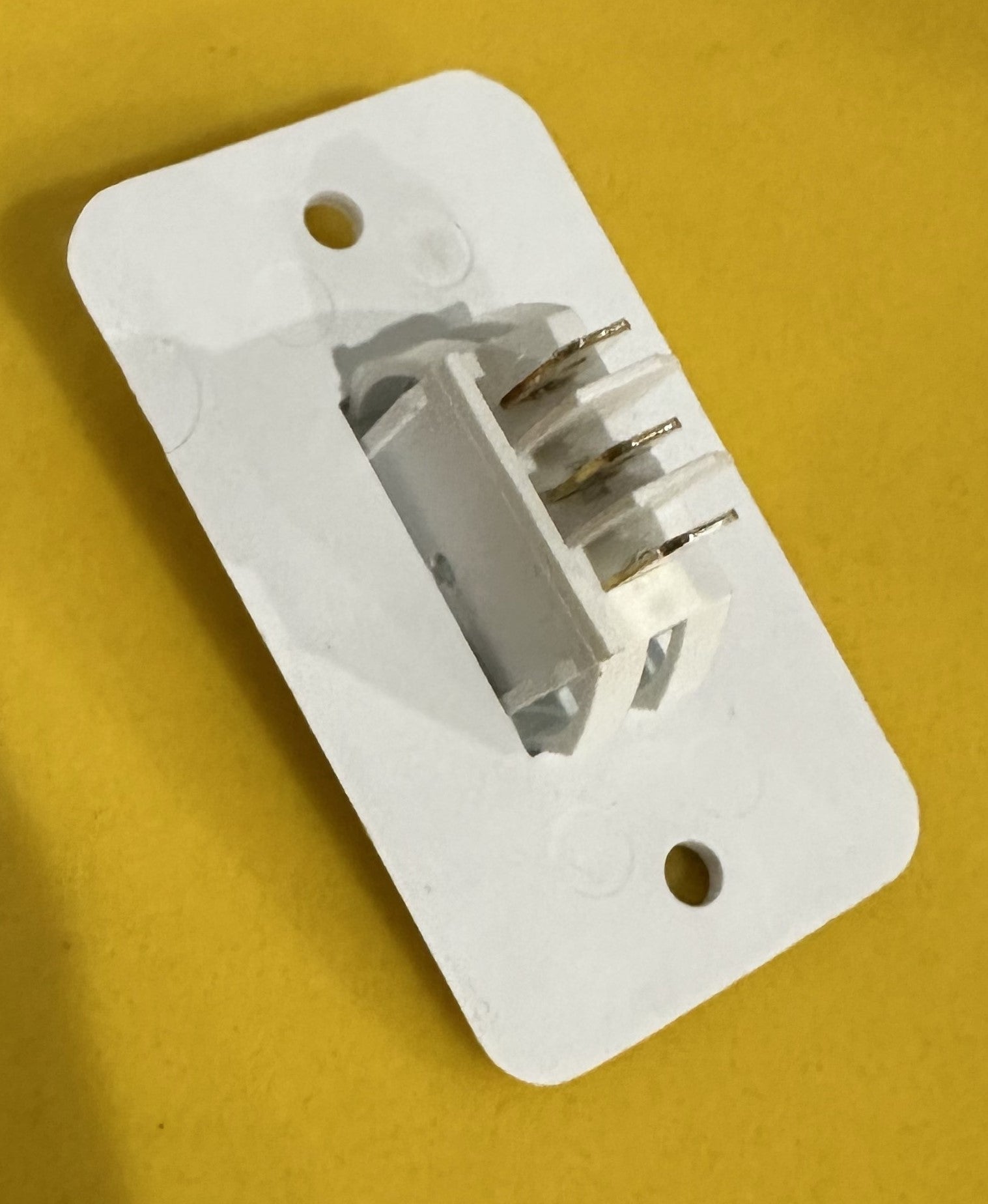 Three-way light switch by Indiana Trailer Sales for electrical and lighting applications, showing the switch's toggle and wiring terminals.