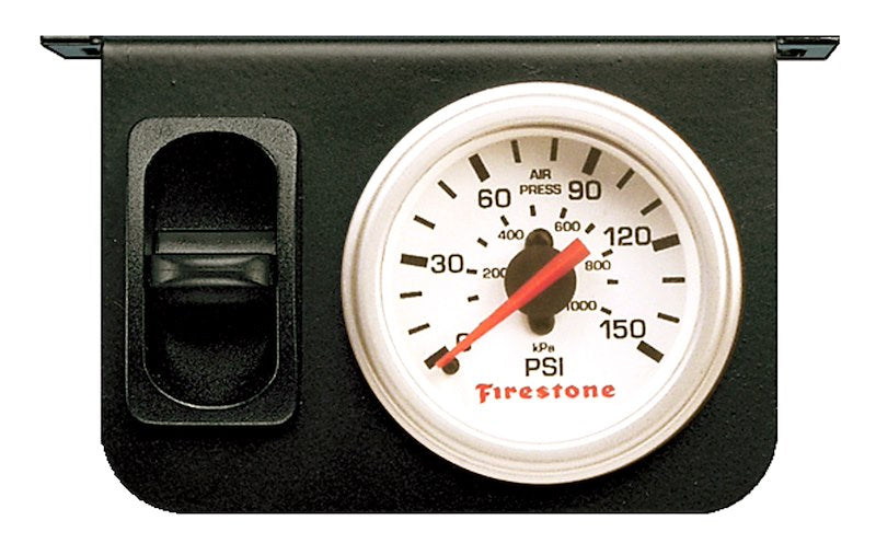 Firestone gauge air pressure display mounted on a truck, showing pressure readings for truck tire maintenance.