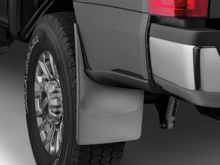 Weather Tech mudflaps installed on Ford SuperDuty truck, durable truck accessories for mud and debris protection.