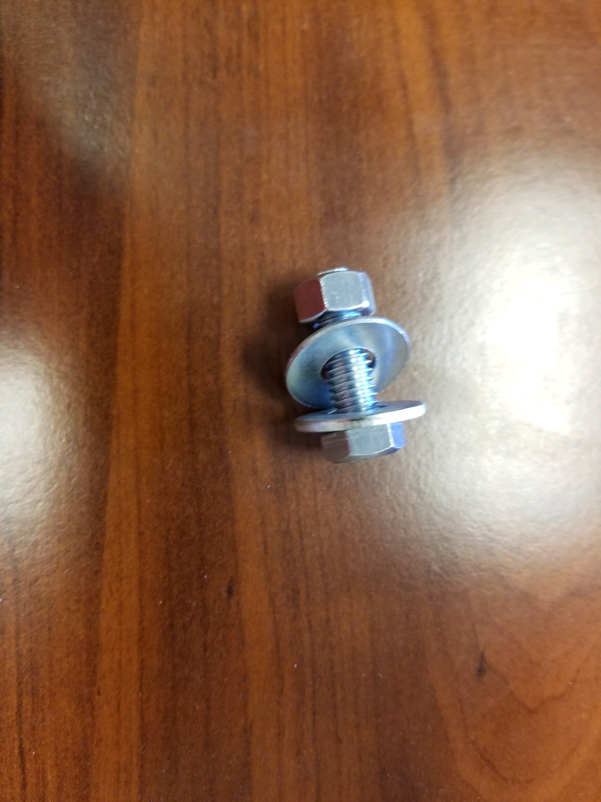 3/8-inch bolt washers and nuts for jacks and couplers, displayed with metal hardware components for automotive use.