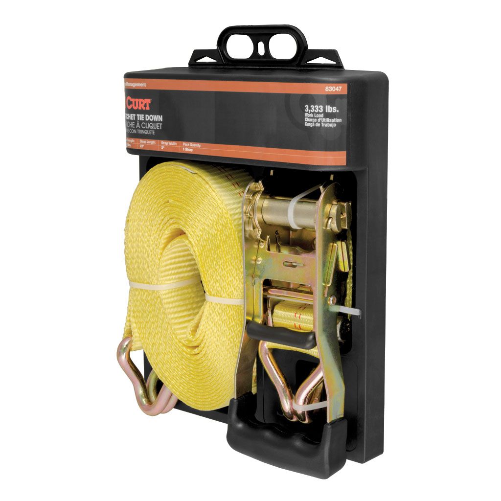 Curt 83047 27ft yellow cargo strap with J-hooks for cargo control, rated at 3333 lbs, in use securing loads.