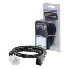 Curt Manufacturing trailer brake controller harness in packaged form, showing electrical connectors and wiring for trailer brake systems.