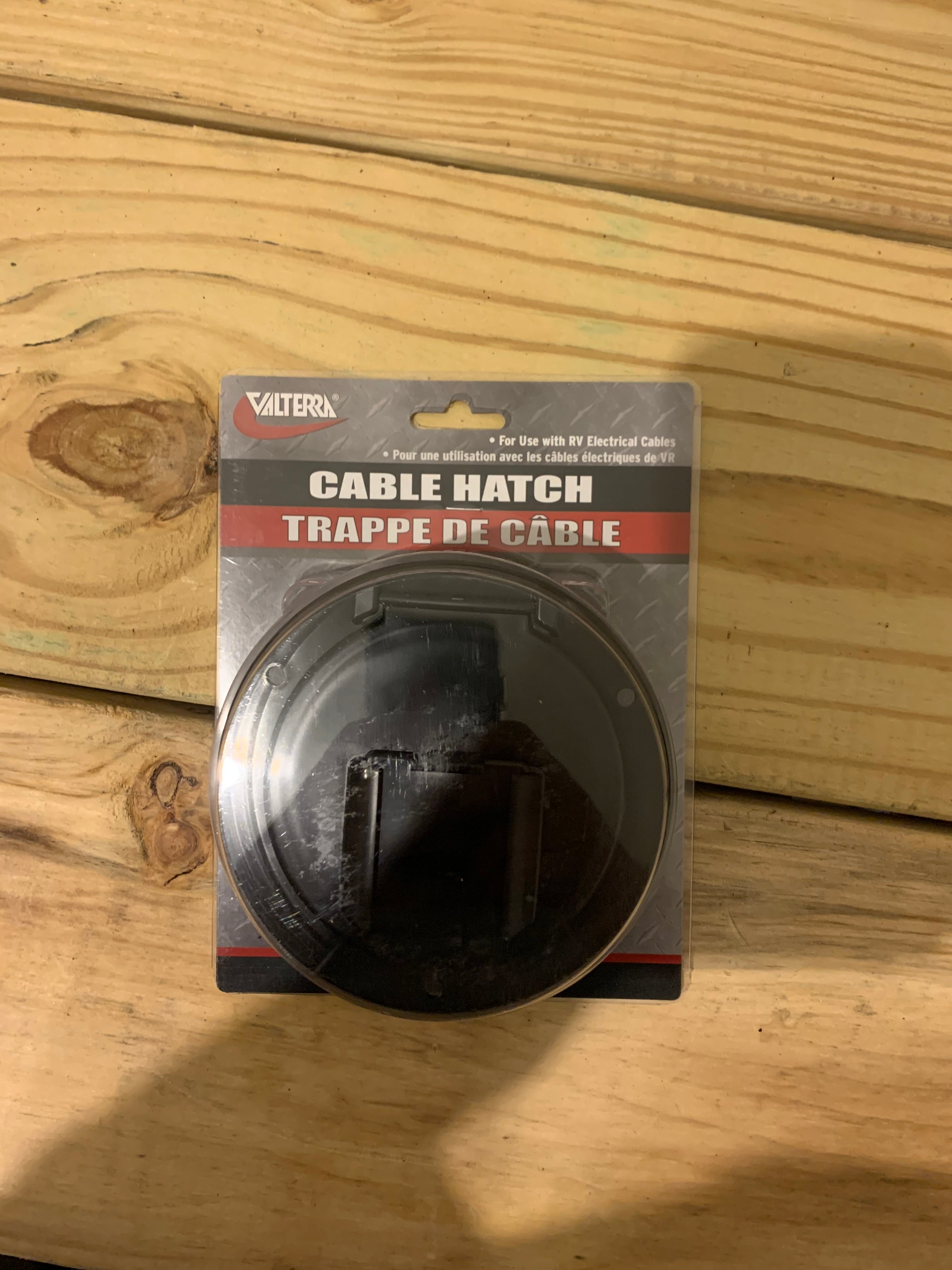 Medium round black cable hatch by Meyer Distributing, designed for electrical and lighting applications.
