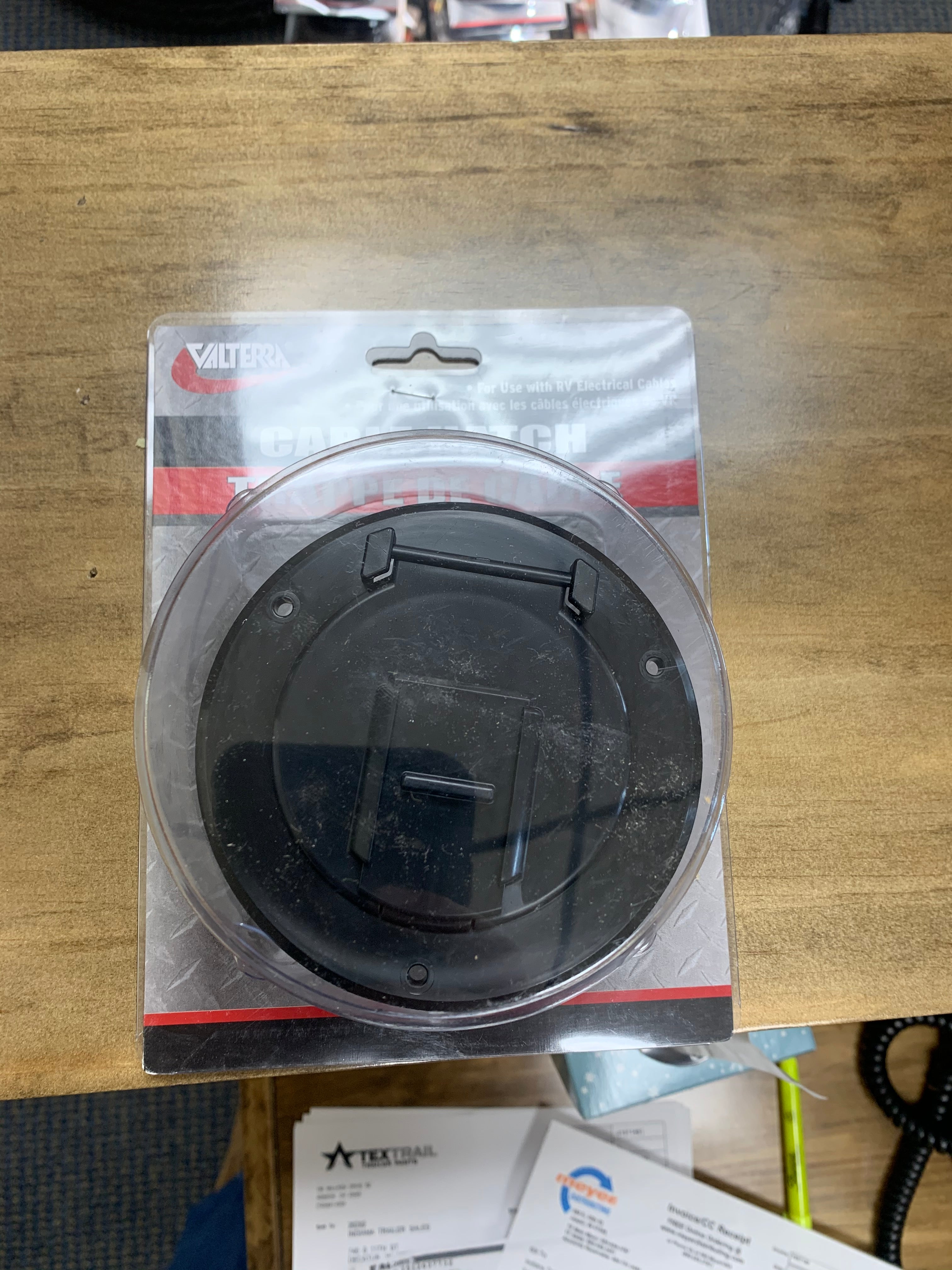 Small round black cable hatch from Meyer Distributing, designed for electrical and lighting installations.