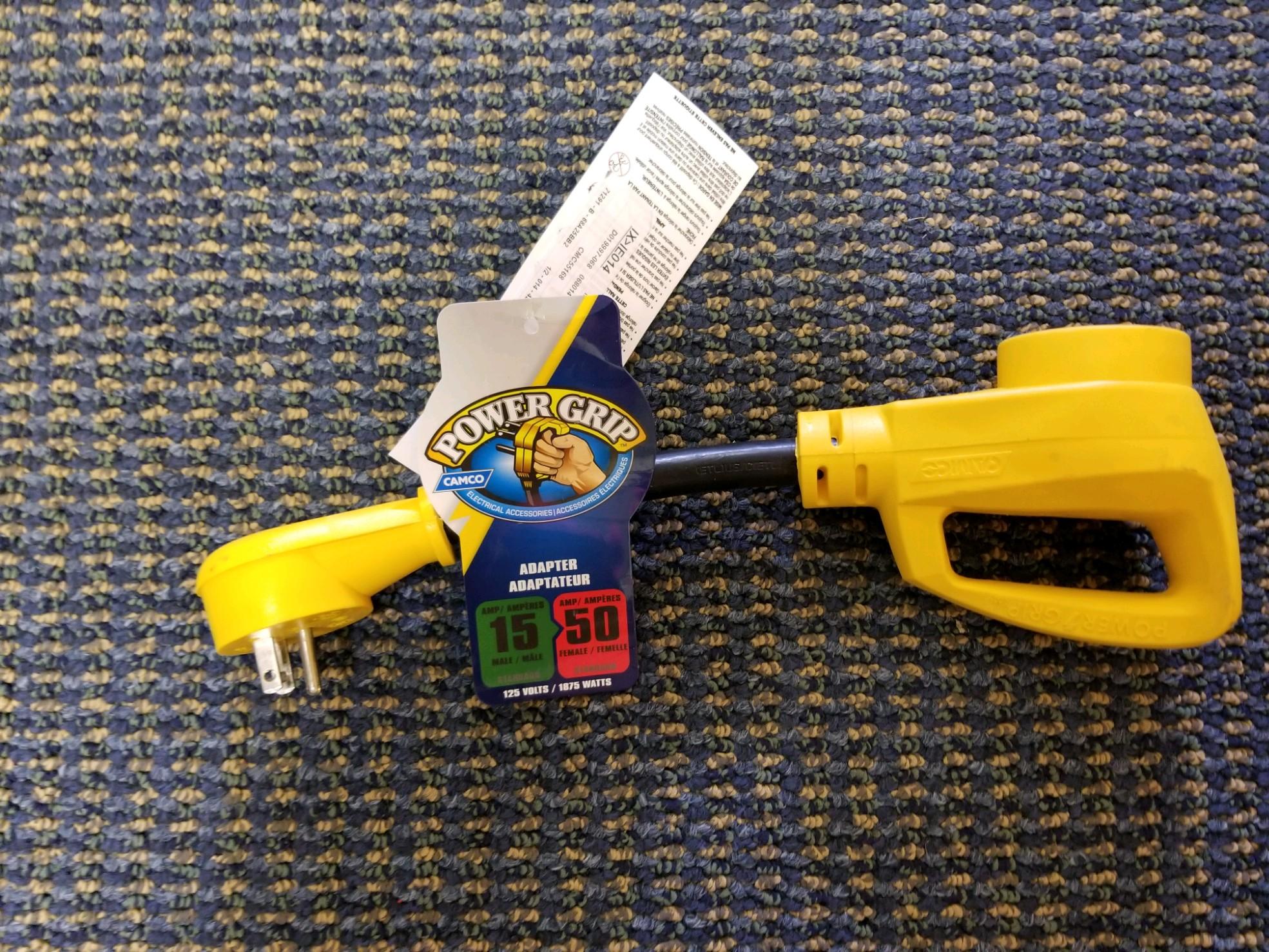 Camco 15M/50F AMP PowerGrip Dogbone electrical extension cord with 125V/1875W capacity, 12-inch length for electrical connections.