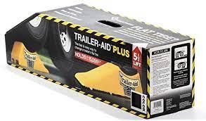 Black Trailer Aid Plus towing safety accessory in box, designed for vehicle assistance and trailer stabilization.