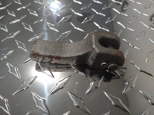 Weld-on 5/16" safety chain bracket for trailer locks by PJ Trailers MFG, Inc., shown in a close-up image.