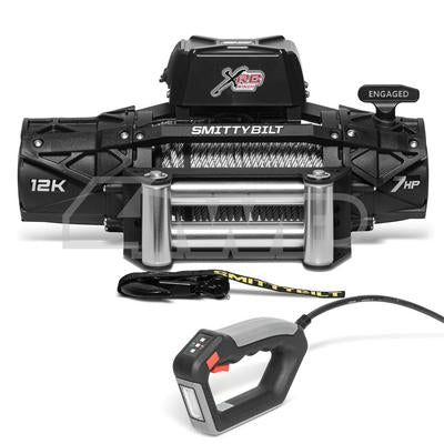 Electric Smittybilt 12000lb winch from PJ Trailers MFG, Inc. with steel cable and remote control for vehicle recovery.