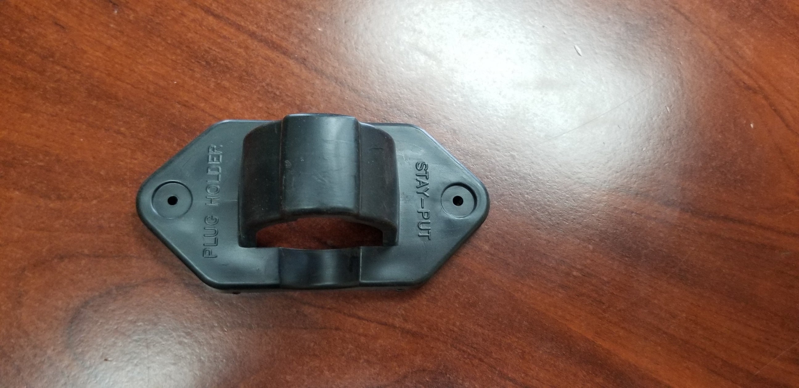QT-Stay Put Bracket by Quality Steel & Aluminum Products, Inc. for body and frame components, shown in a close-up image.