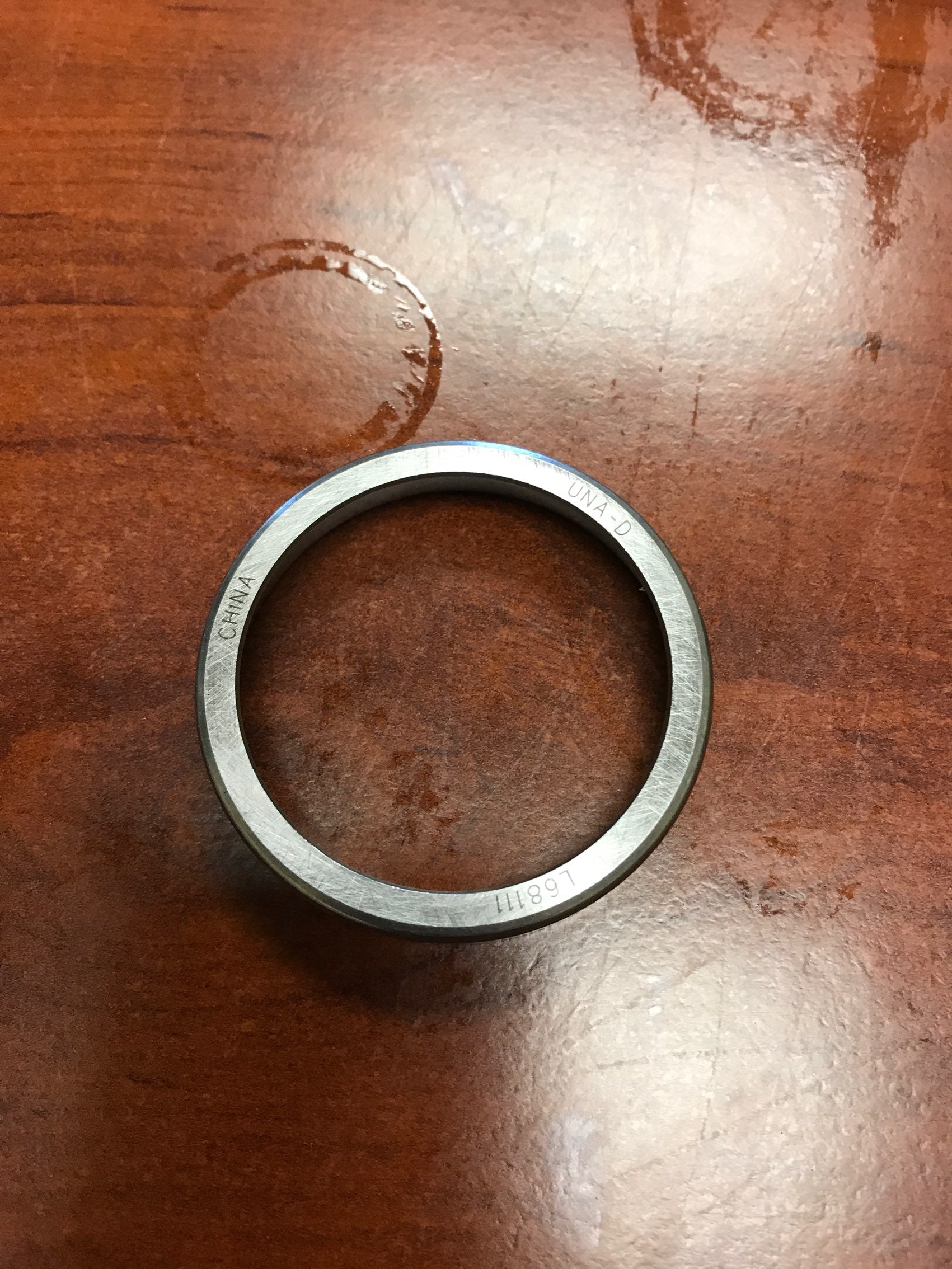 Tex Trail bearing race L68111 with 2.362-inch outer diameter, designed for axle components, shown in a close-up image.