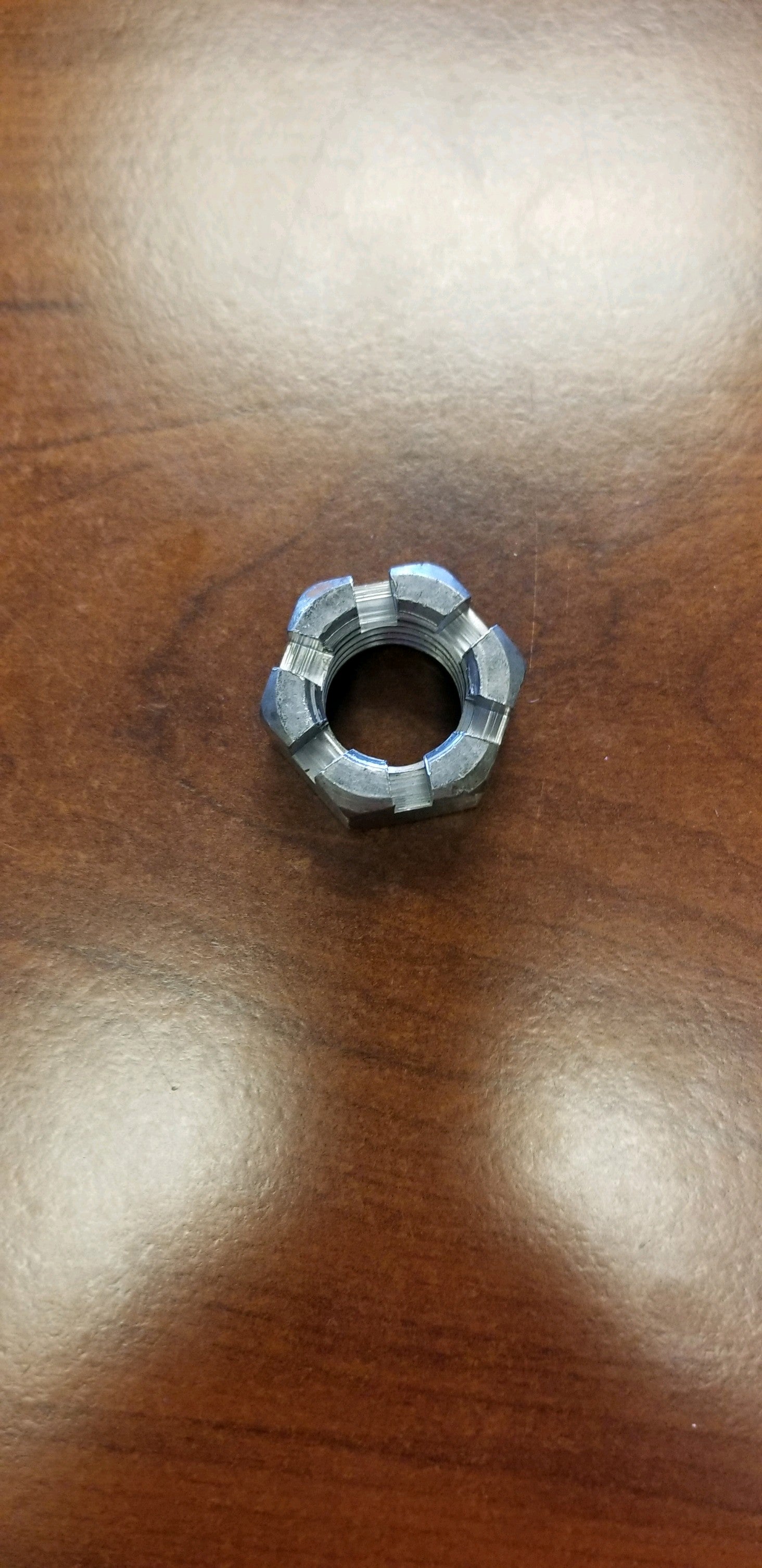 Tex Trail 7/8-9 castle nut for axle components, showing the sturdy metal nut with threading and flange for secure fastening.