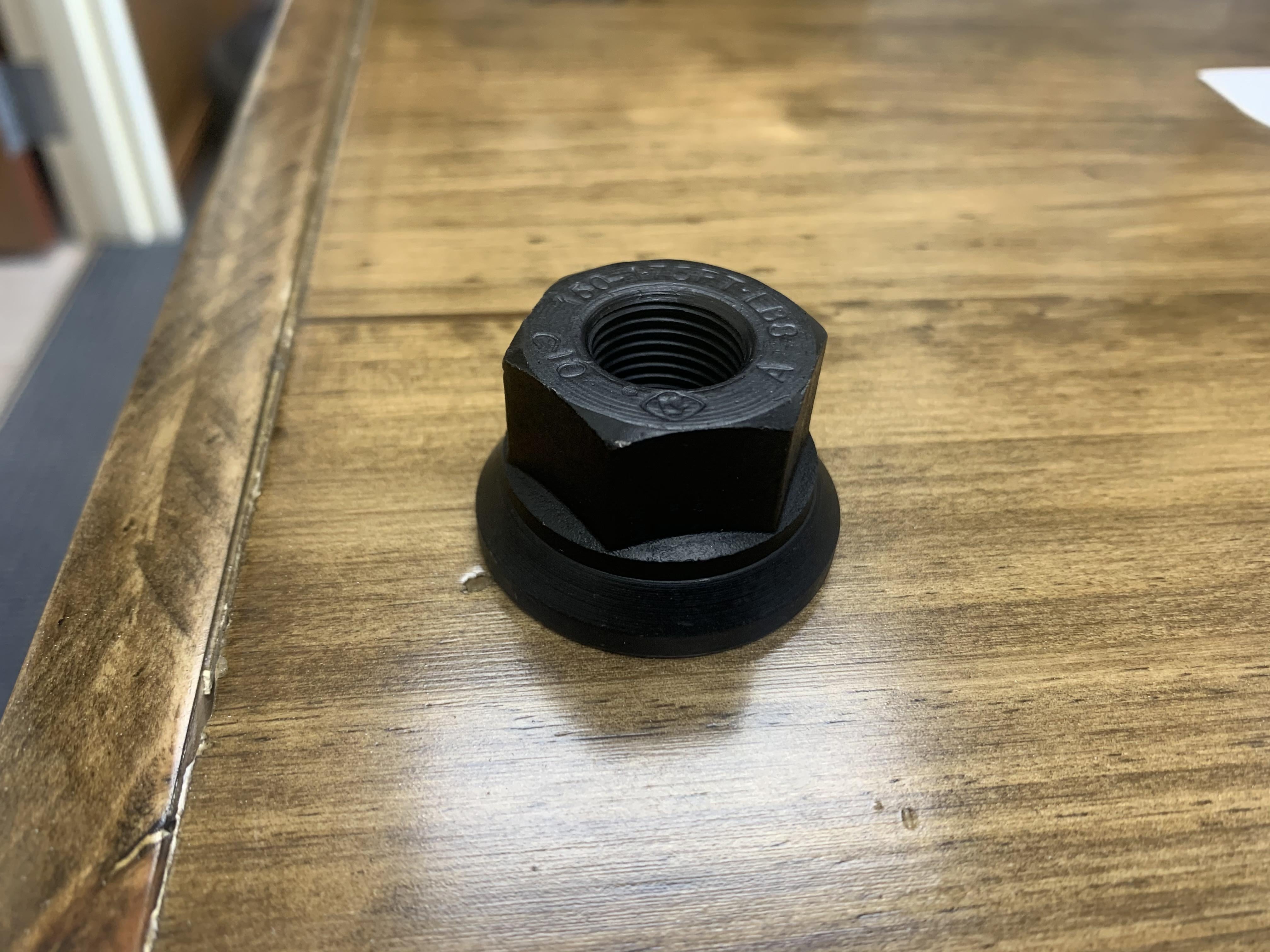 Tex Trail Nut Flange 5/8-18 Al-Ko swiveling flange nut for axle components, shown with textured metal surface and threading.