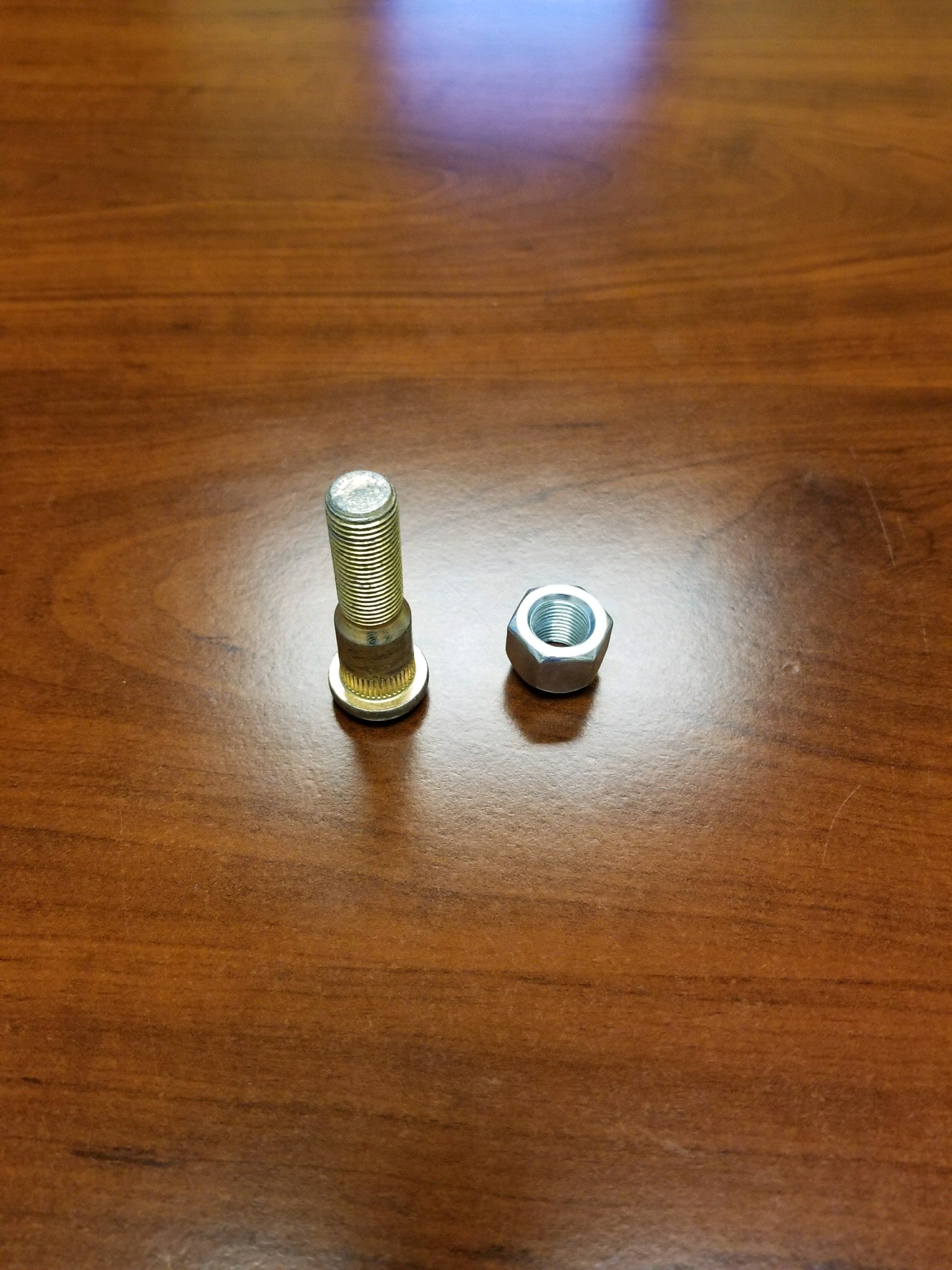 Tex Trail Stud 9/16 axle component showing a metal stud used in heavy-duty vehicle axles.
