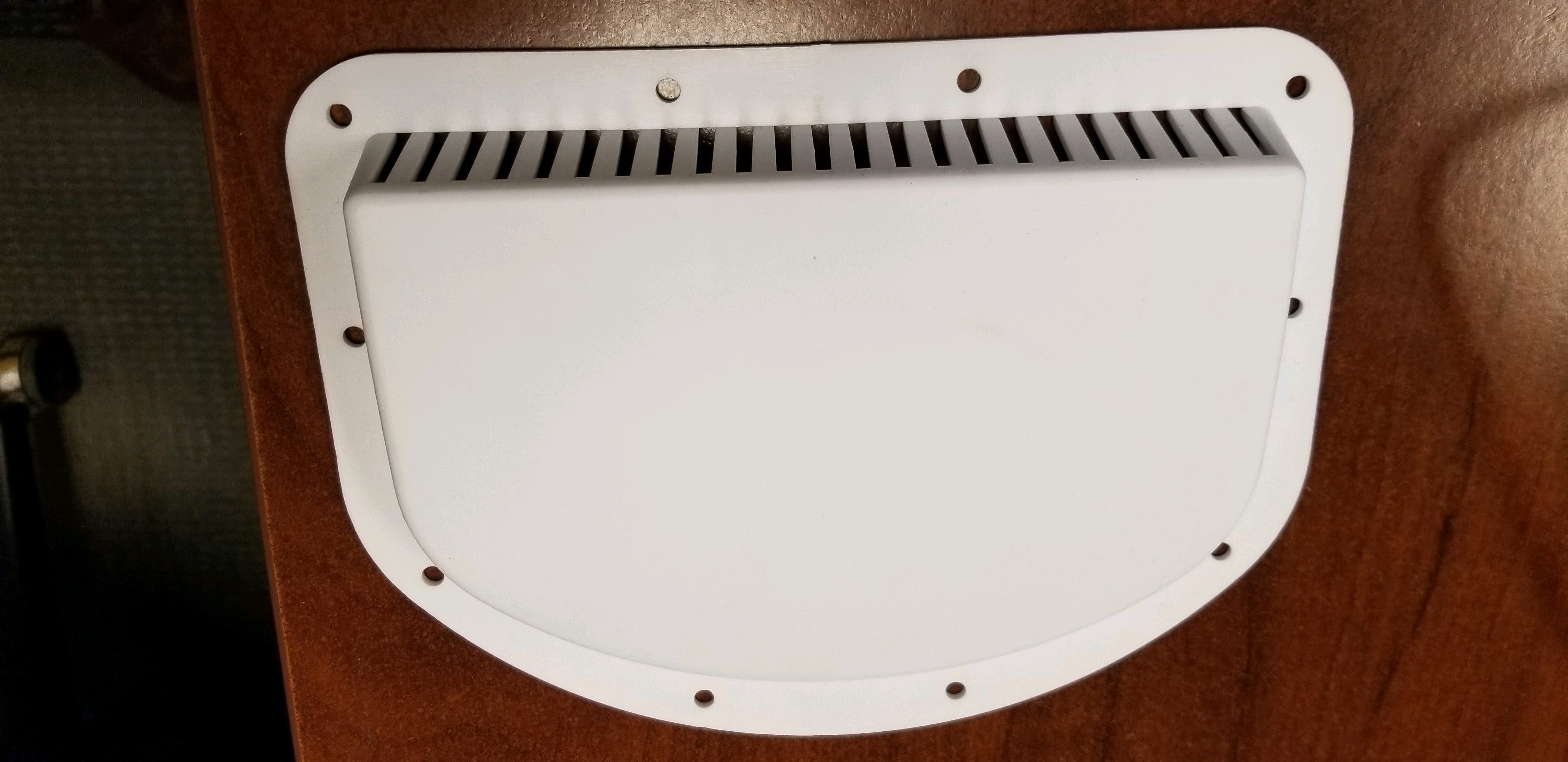 White exterior vent half-moon component for body and frame, designed by Tex Trail for durable vehicle ventilation.