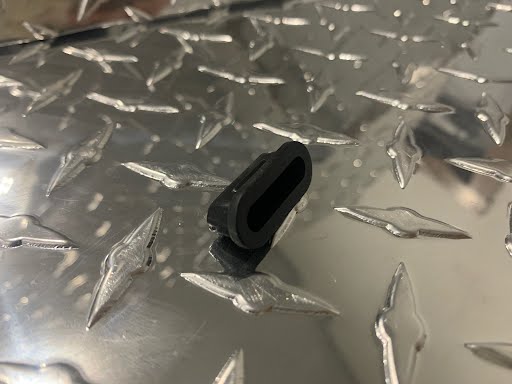 Tex Trail adjuster slot plug for 2K-8K brake systems, shown in the image with a black plastic component.
