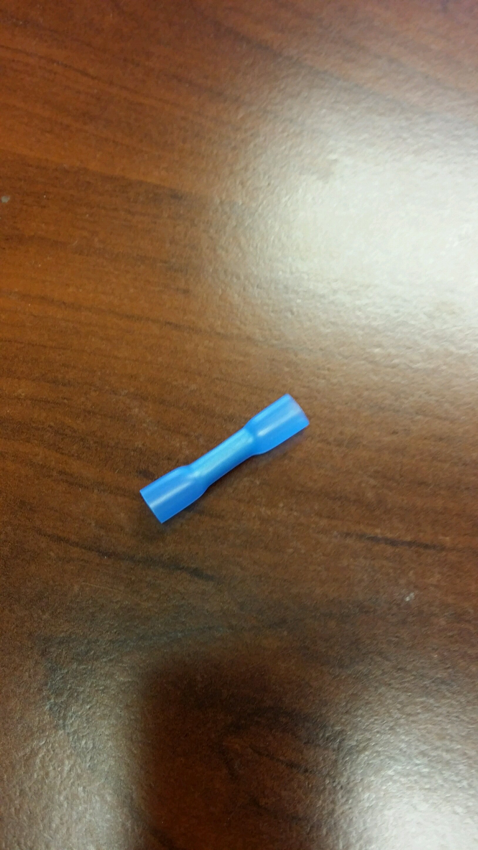 Blue heat shrink insulated connector butt terminal for 16-14 gauge electrical wiring by Tex Trail.