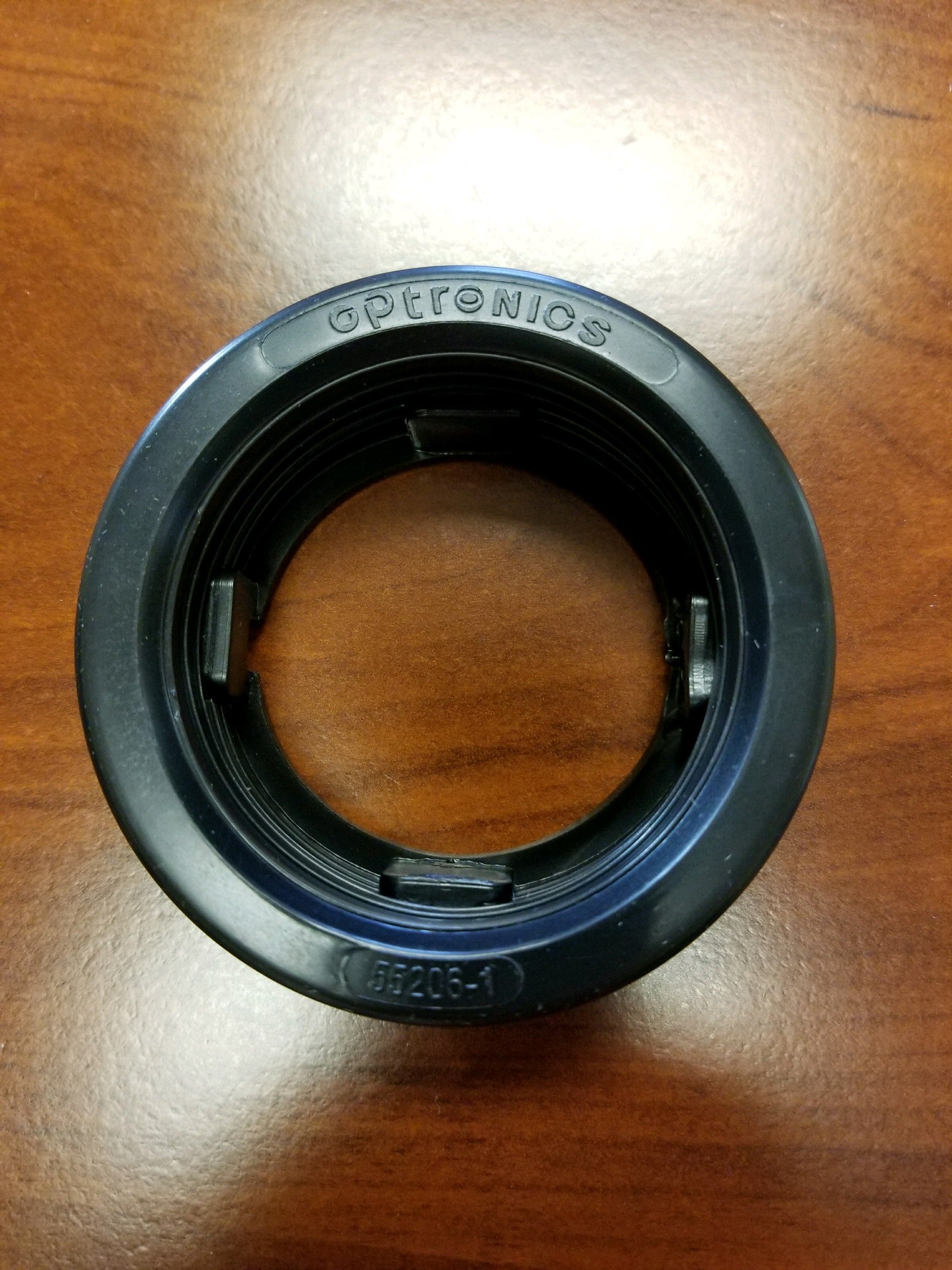 Black 2.5-inch flush mount PVC grommet from Tex Trail, used for electrical and lighting installations in panels or enclosures.
