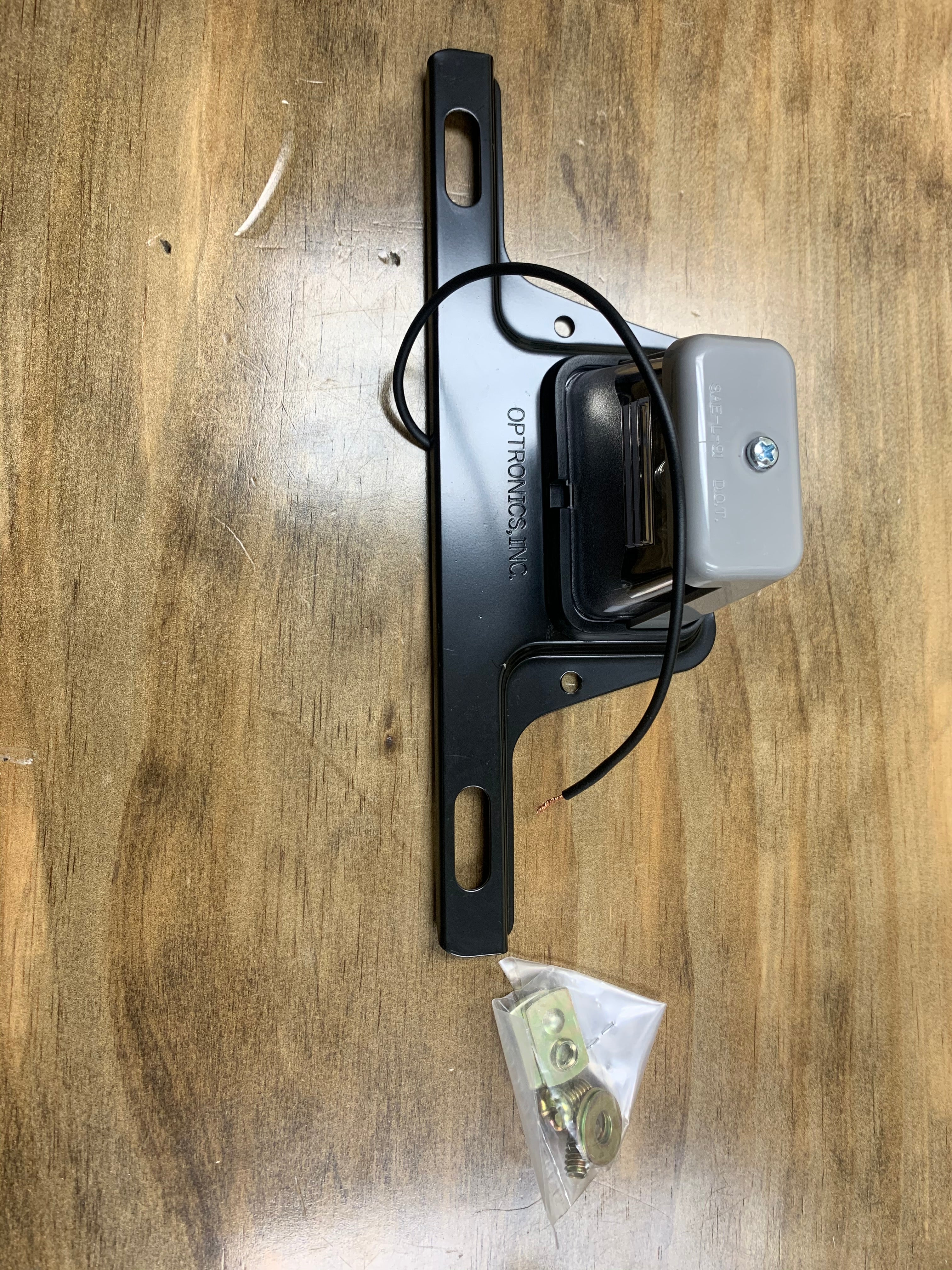 Tex Trail license plate light with bracket, 1.875W electrical light for vehicle license illumination.