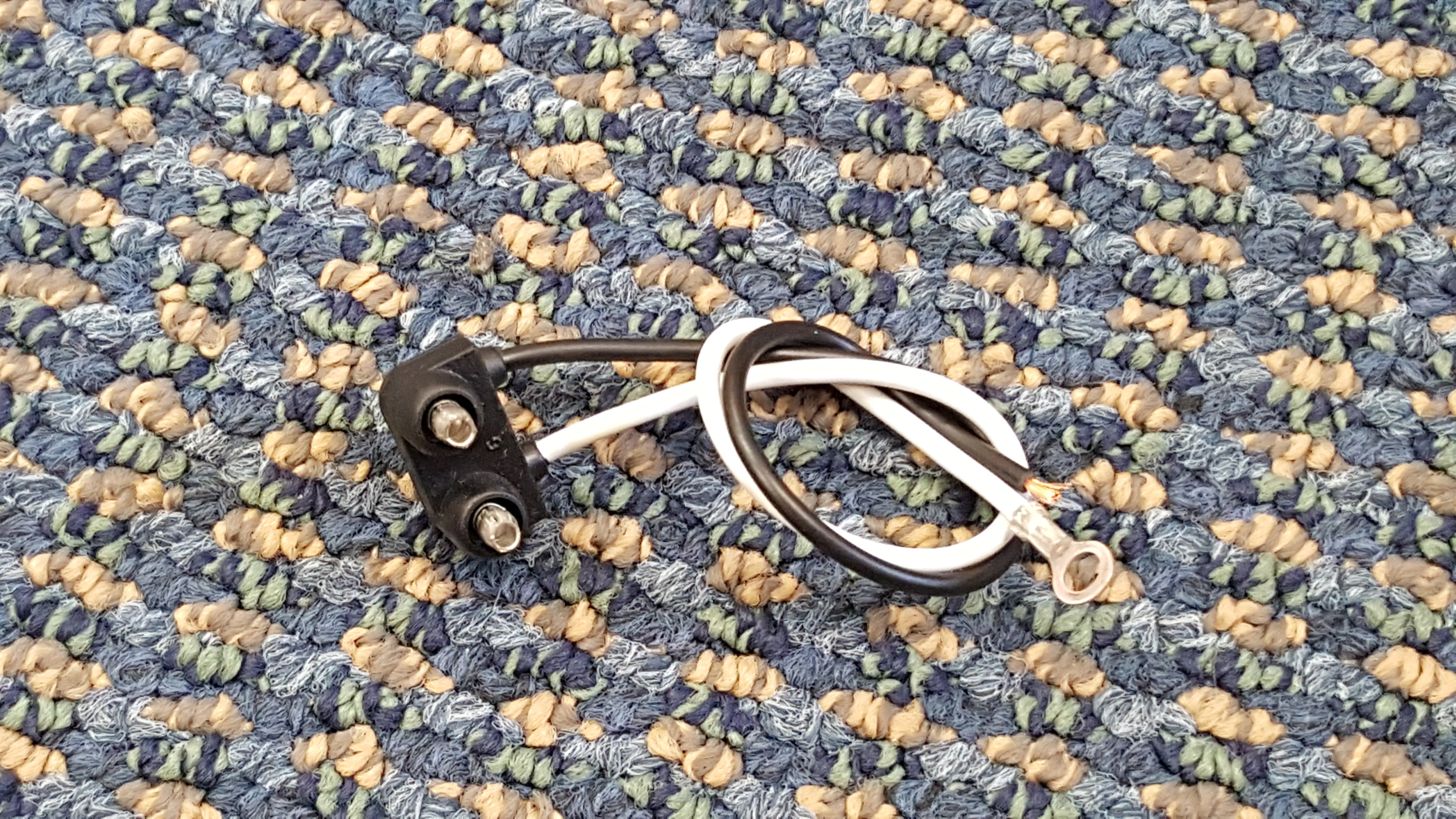 Tex Trail PL-10 Pigtail 2-Wire Right Angle electrical connector for lights, showing the right-angle design and two-wire setup.