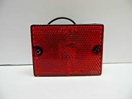 Red side lens for electrical and lighting applications, measuring 2.75 x 2.125 inches, by Tex Trail.