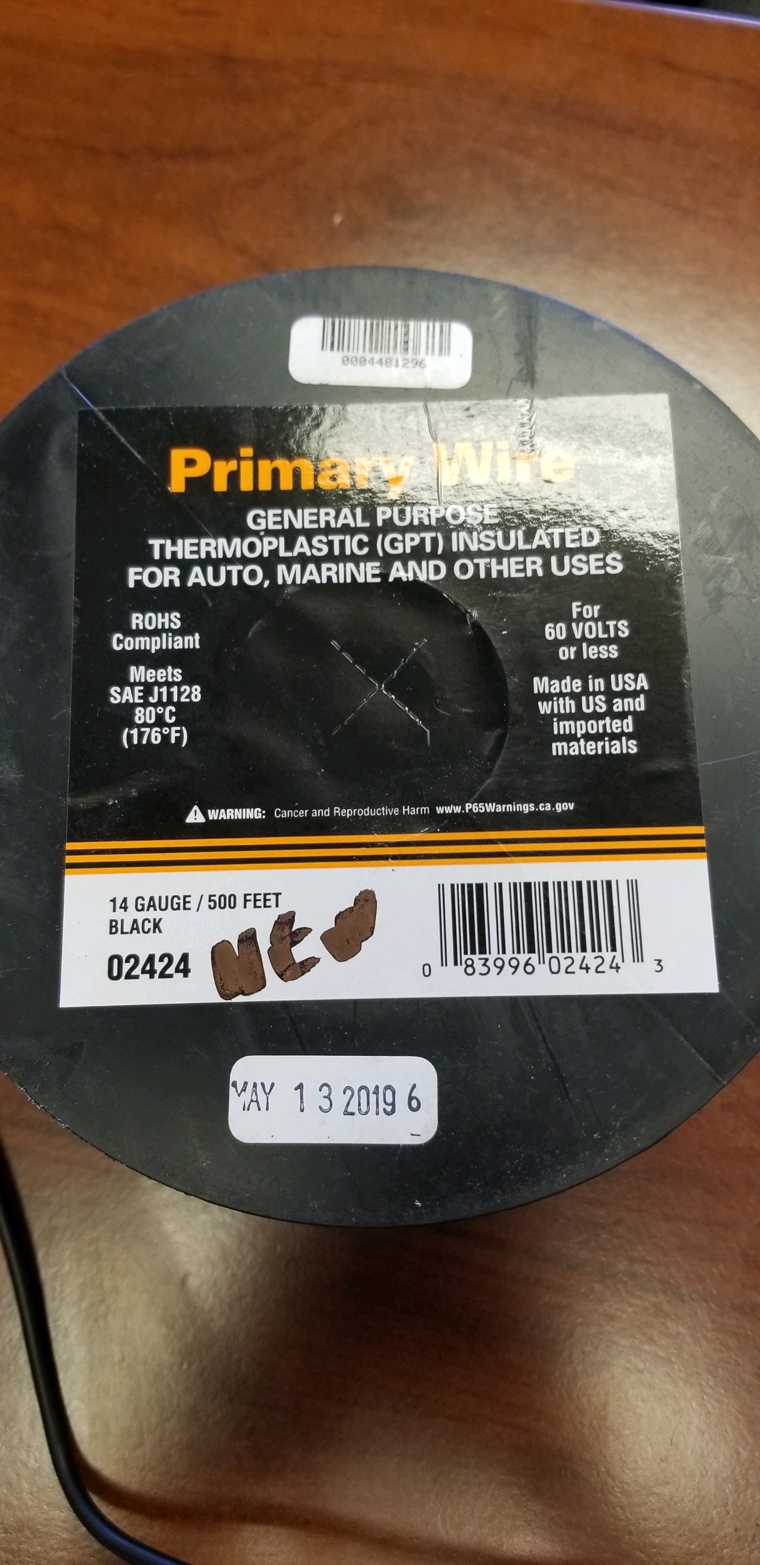Black Tex Trail 14/1 electrical wire for lighting and electrical projects, shown coiled and ready for use.