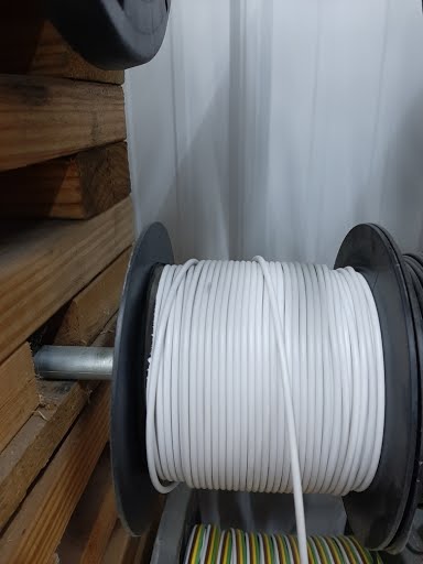 White electrical wire 14/1 by Tex Trail, shown coiled and ready for installation, perfect for electrical and lighting projects.