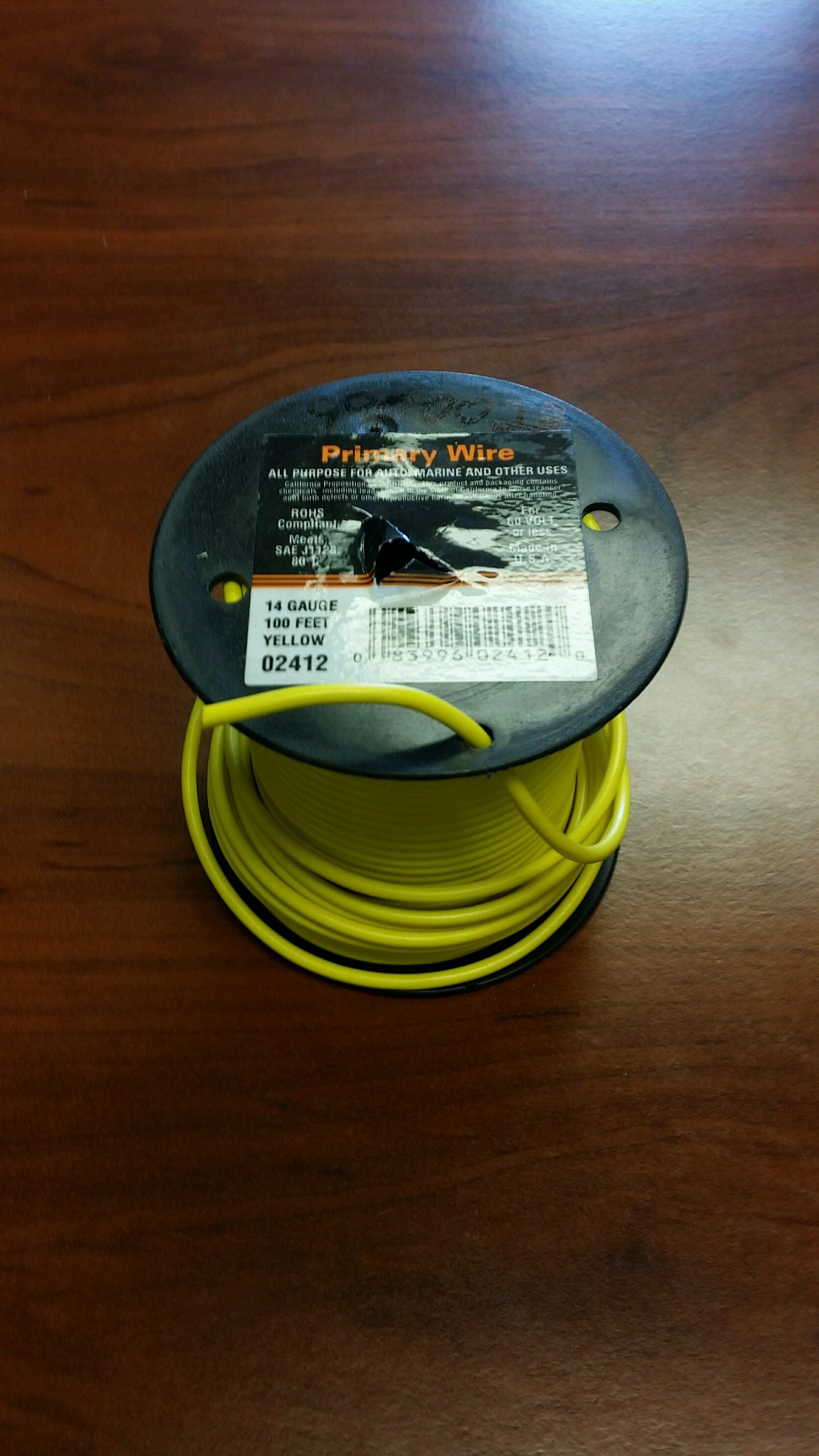 Yellow Tex Trail 14/1 electrical wire for lighting, sold by the foot, shown coiled with visible insulation and connectors.