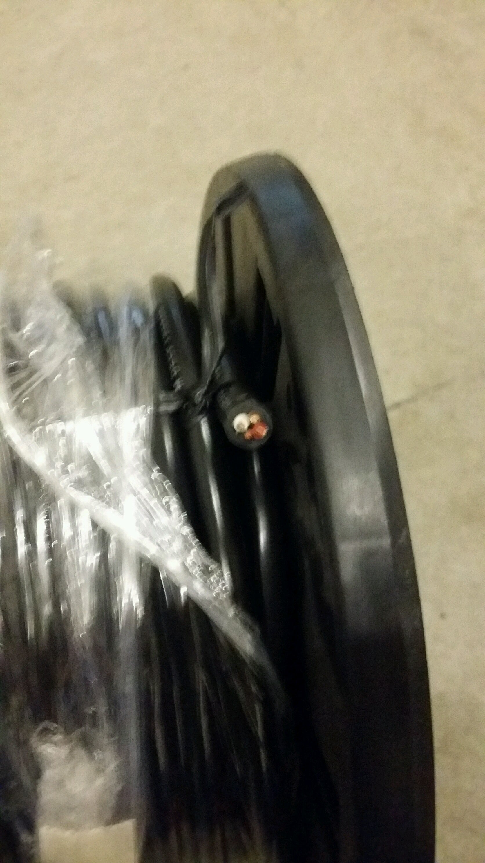Electrical wire Tex Trail 14/4 WT/BR/RD/BK in black, red, brown, and white colors, sold by the foot, for electrical projects.