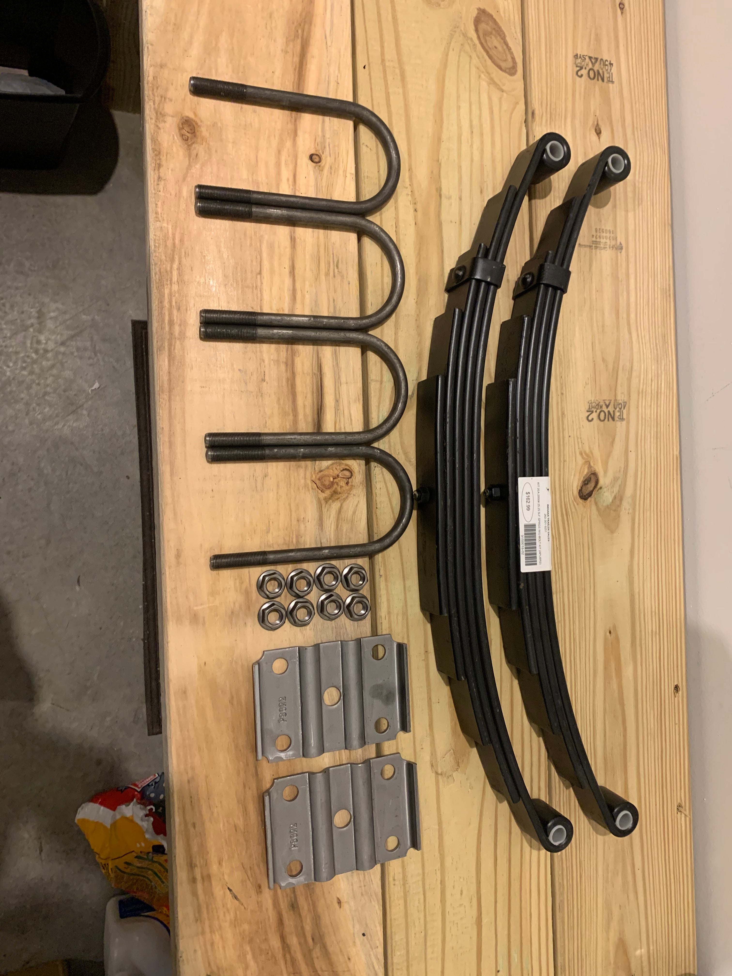 Tex Trail suspension kit with two 2950# 25.25-inch springs and U-bolt kit for vehicle suspension repair.