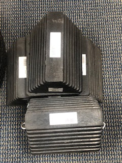 Rubber wheel chock from Tex Trail for towing safety, designed to prevent vehicle movement during towing or parking.