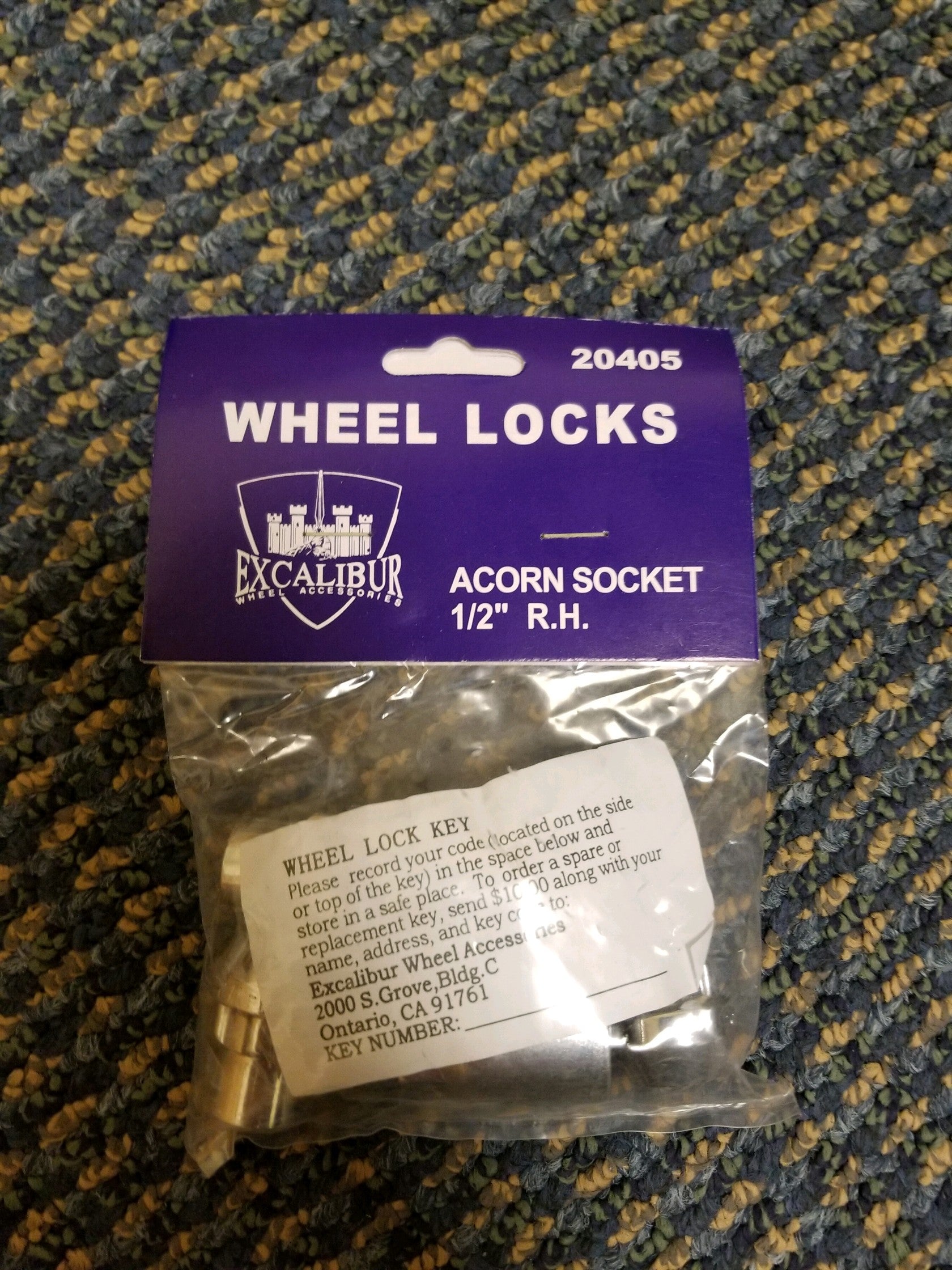 Tex Trail locking wheel nut for 1/2" bolts, used for towing accessories and vehicle safety, shown on a vehicle wheel.