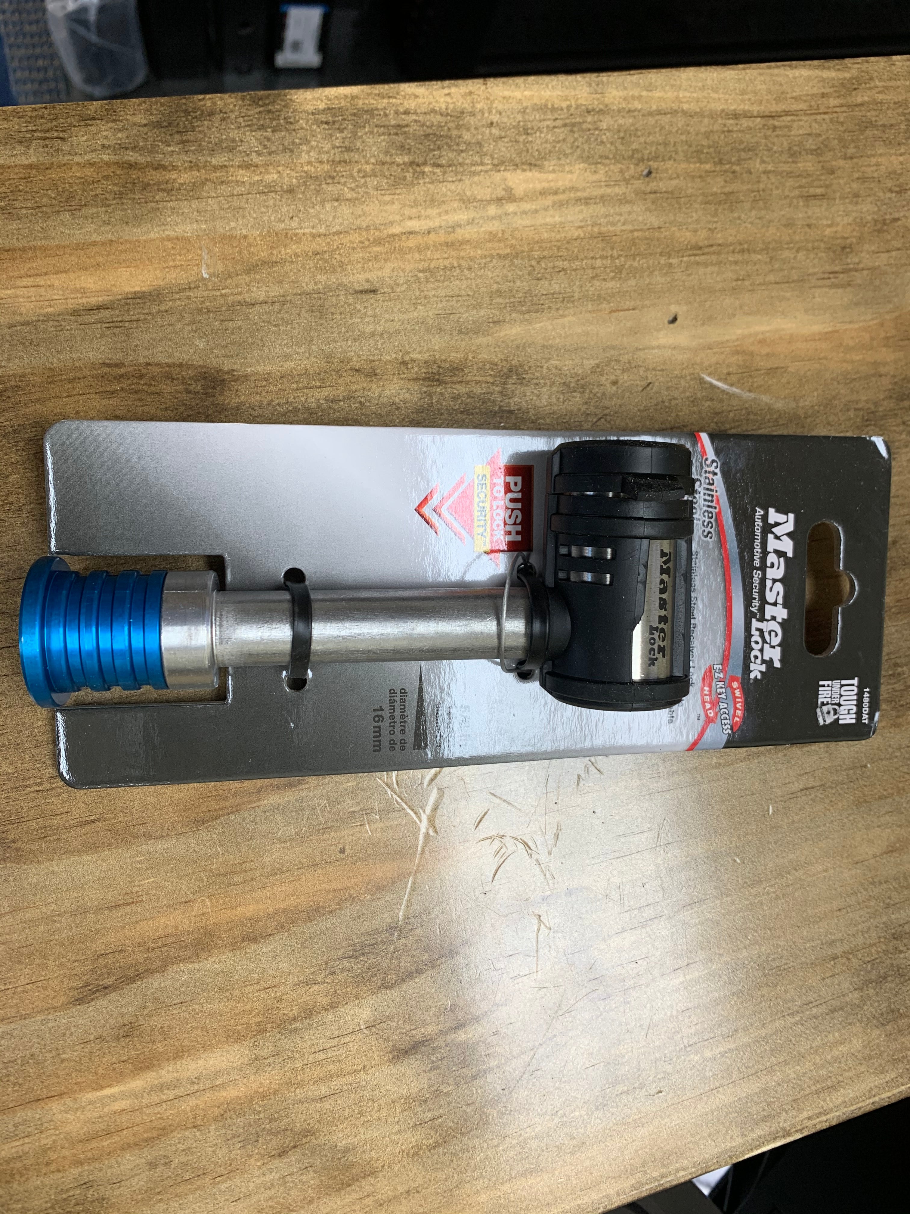 Masterlock trailer receiver lock in 5/8 inch stainless steel with 2-3/4 inch length, designed for secure trailer hitch protection.