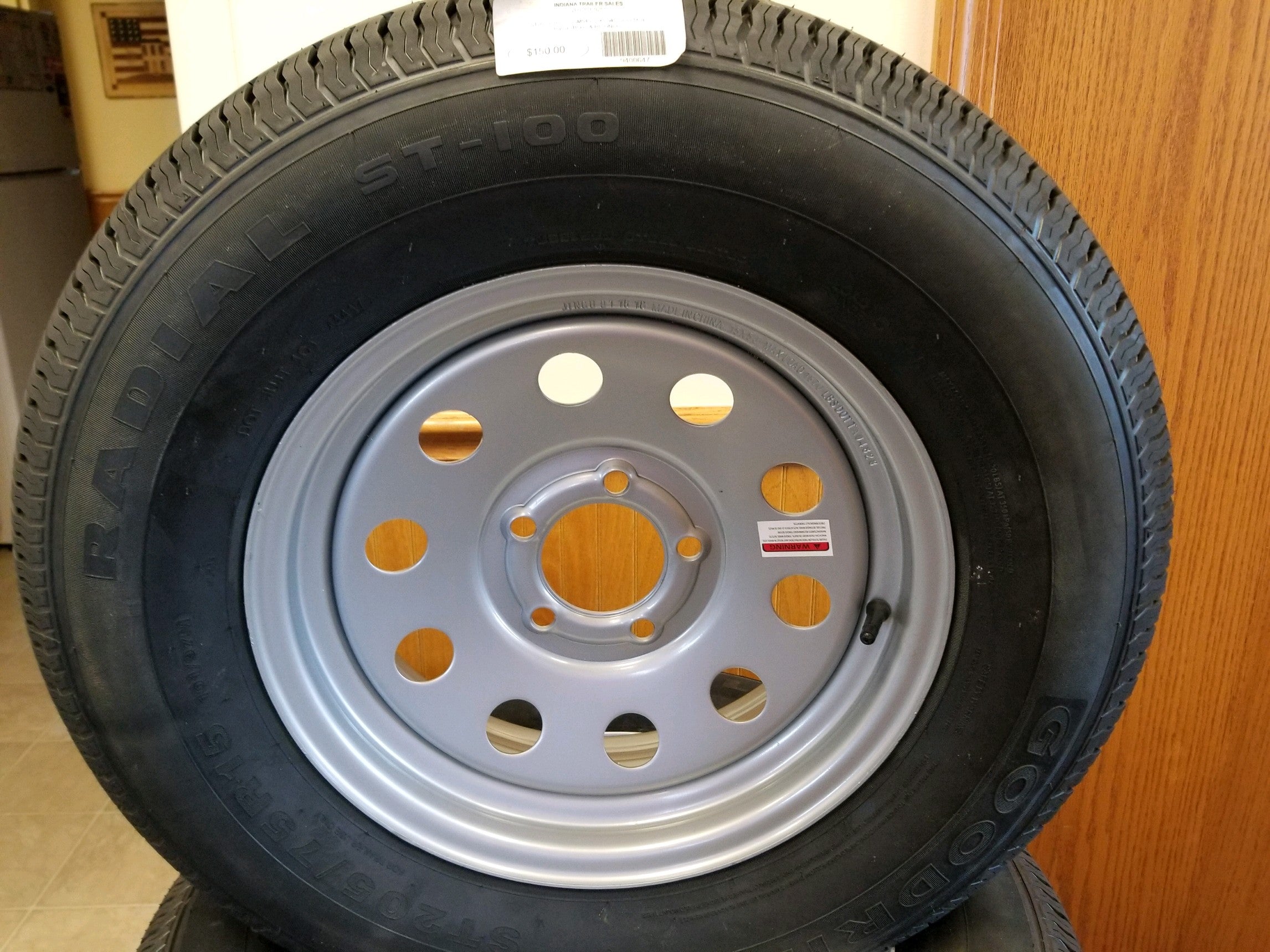 Tex Trail ST205RLRC-155SM545 wheels and tires set showing rugged tire tread and sturdy alloy wheel design.