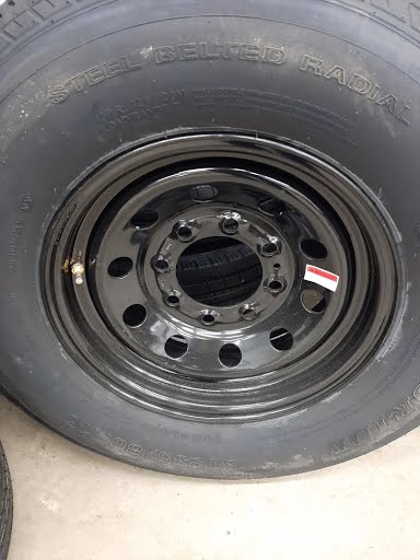 Tex Trail ST23580RLRE-166BM865 10PLY tires and wheels, rugged off-road design, black rubber tires mounted on sturdy wheels.